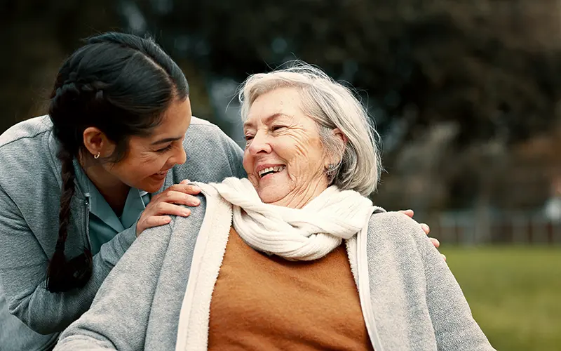 a young woman caring for an elderly woman