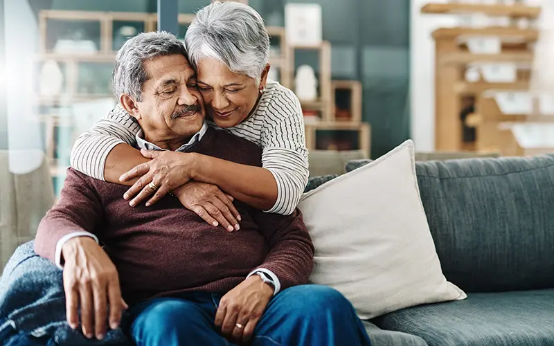 an elderly couple sharing an intimate moment