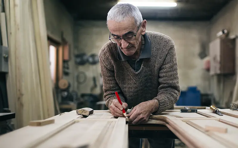 senior man working on a wood project